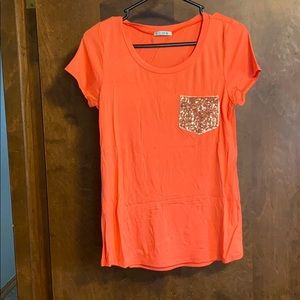Coral t shirt with gold pocket